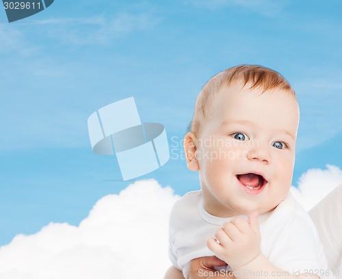 Image of close up of mother holding smiling baby