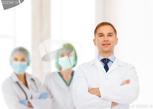 Image of smiling male doctor in white coat