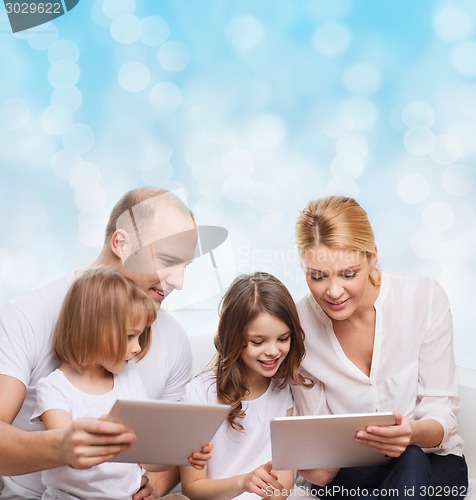 Image of happy family with tablet pc computers