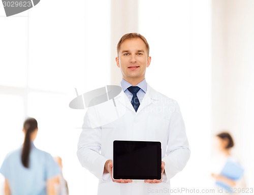 Image of smiling male doctor with tablet pc