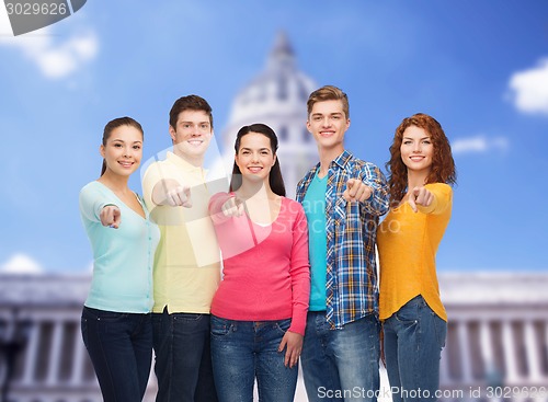 Image of group of smiling teenagers showing ok sign