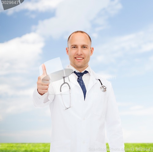 Image of smiling doctor with stethoscope showing thumbs up