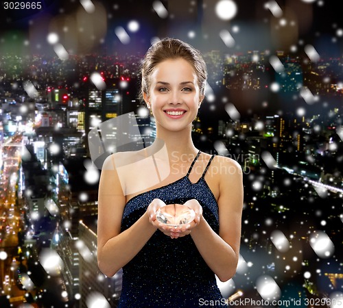 Image of smiling woman in evening dress with diamond