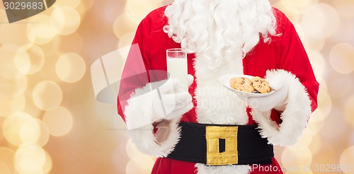 Image of santa claus with glass of milk and cookies