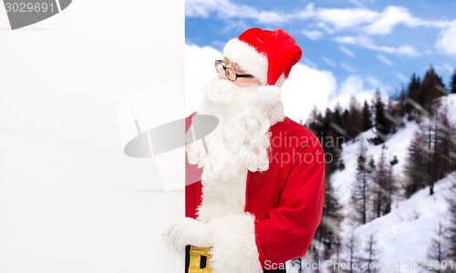 Image of man in costume of santa claus with billboard