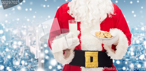 Image of santa claus with glass of milk and cookies