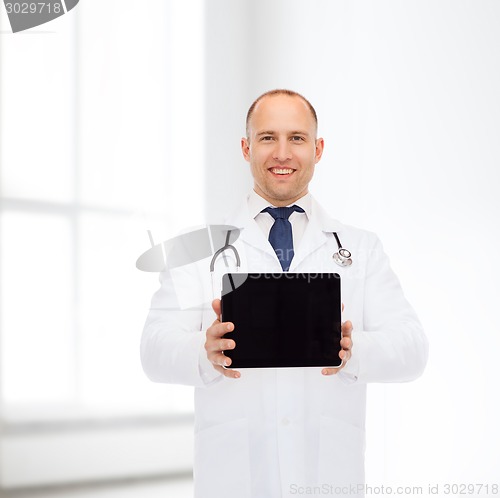 Image of smiling male doctor with stethoscope and tablet pc