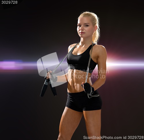 Image of sporty woman with skipping rope