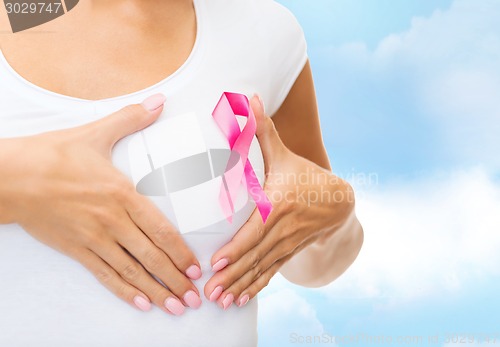 Image of close up of woman with cancer awareness ribbon