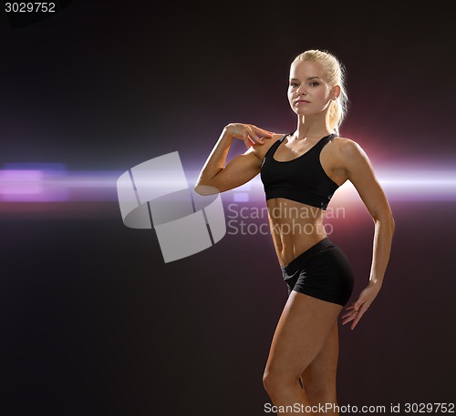 Image of beautiful athletic woman in sportswear