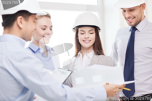 Image of happy business team in office