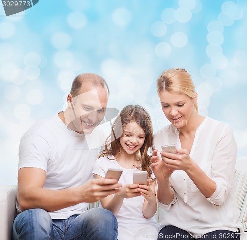 Image of happy family with smartphones