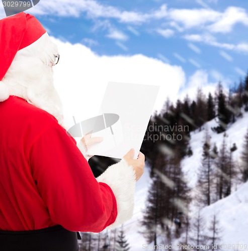 Image of man in costume of santa claus with letter
