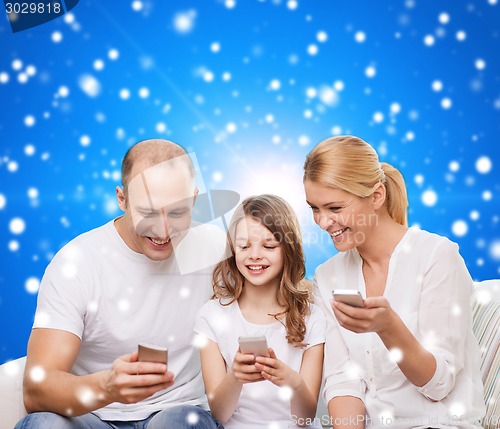 Image of happy family with smartphones