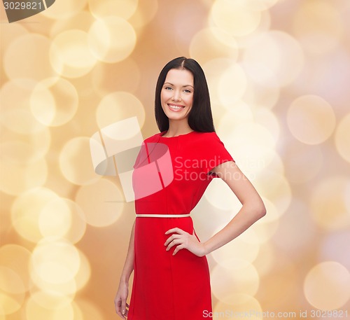 Image of smiling woman in red dress