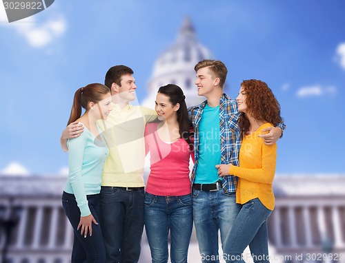 Image of group of smiling teenagers showing ok sign