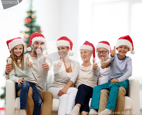 Image of happy family sitting on couch at home