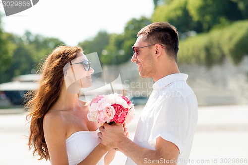 Image of smiling couple in city