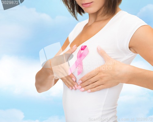 Image of close up of woman with cancer awareness ribbon