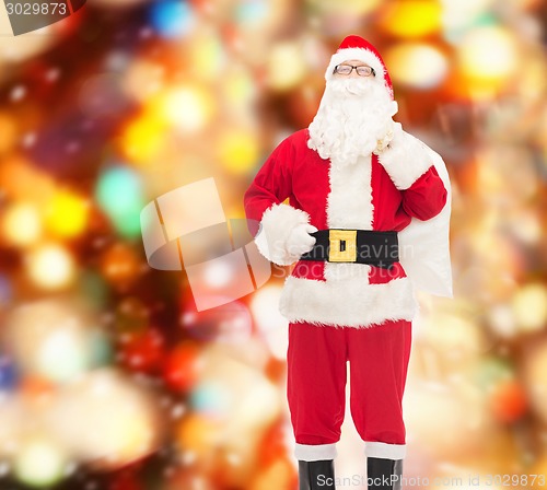 Image of man in costume of santa claus with bag