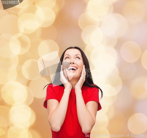 Image of smiling woman in red dress