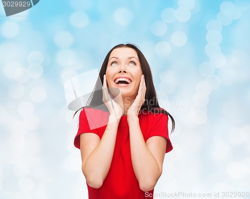 Image of smiling woman in red dress