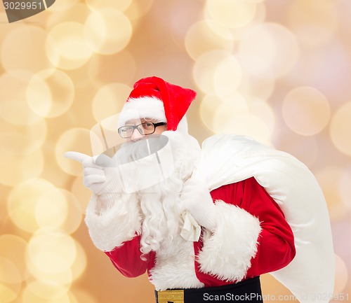 Image of man in costume of santa claus with bag