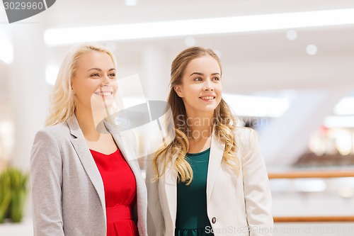 Image of happy young women in mall or business center