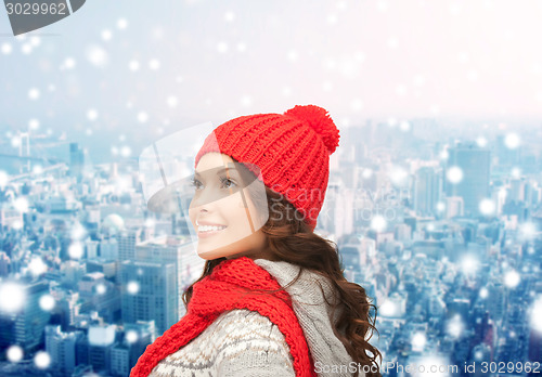 Image of smiling young woman in winter clothes