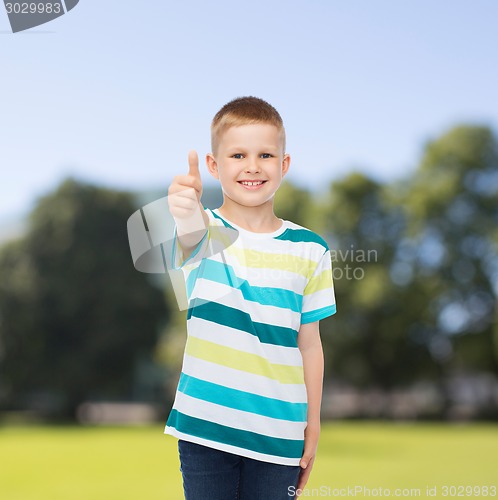 Image of little boy in casual clothes with arms crossed