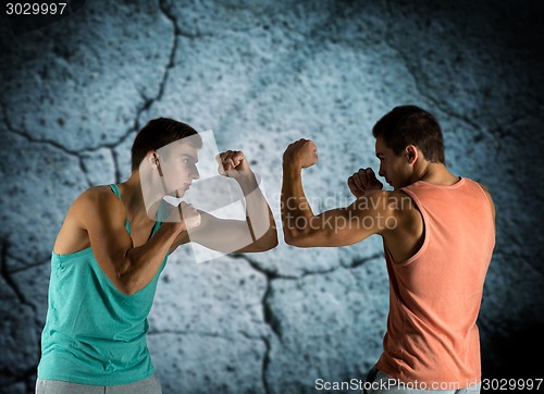 Image of young men fighting hand-to-hand