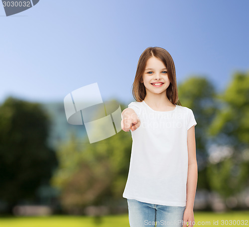 Image of smiling little girl in white blank t-shirt