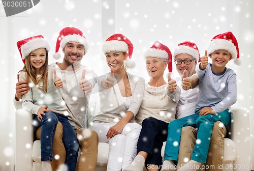 Image of happy family sitting on couch at home