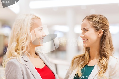 Image of happy young women in mall or business center