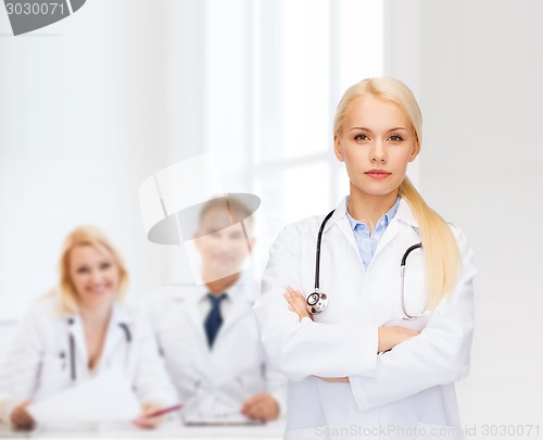 Image of serious female doctor with stethoscope