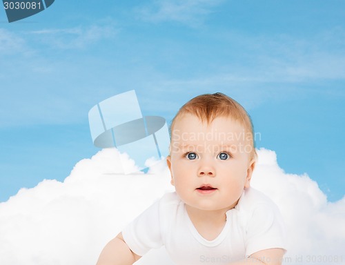 Image of smiling baby looking up