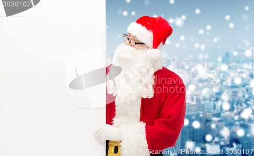 Image of man in costume of santa claus with billboard