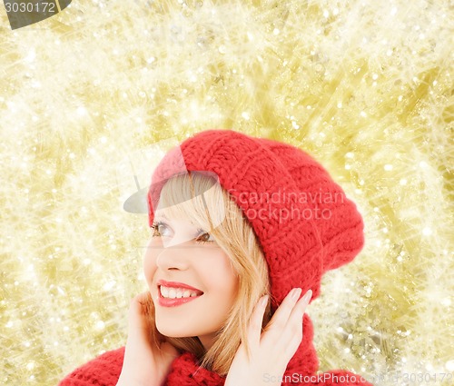 Image of smiling young woman in winter clothes