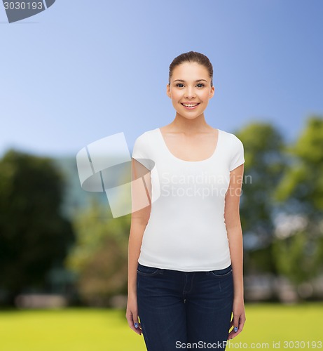 Image of smiling young woman in blank white t-shirt