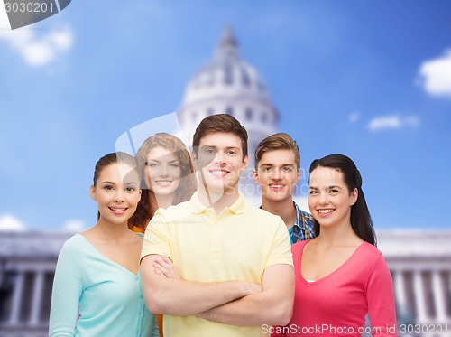 Image of group of smiling teenagers showing ok sign