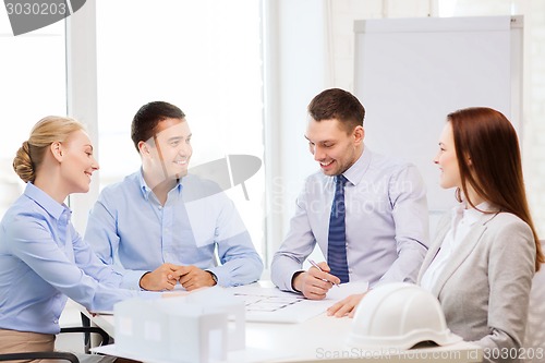 Image of happy team of architects and designers in office