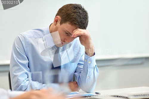 Image of businessman having problem in office