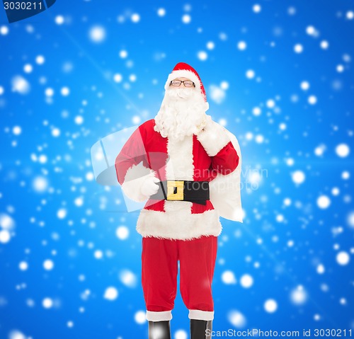 Image of man in costume of santa claus with bag