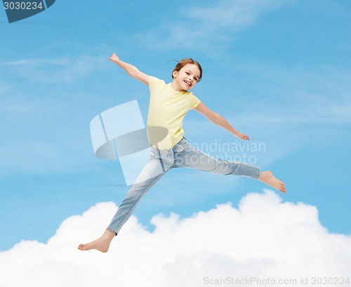 Image of smiling little girl jumping