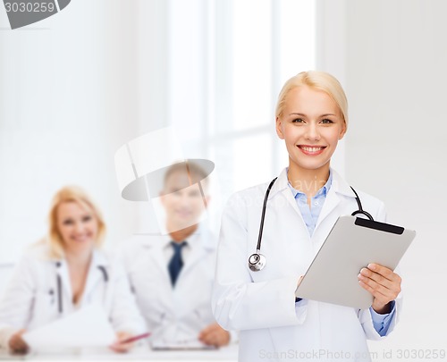 Image of female doctor with stethoscope and tablet pc