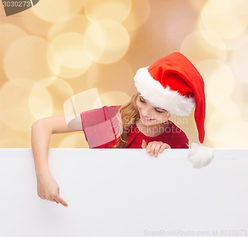 Image of girl in santa helper hat with blank white board