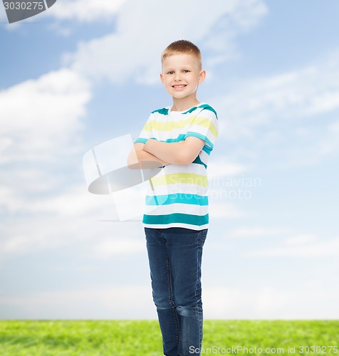 Image of little boy in casual clothes with arms crossed