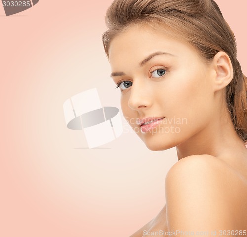 Image of beautiful young woman with bare shoulders