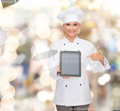 Image of smiling female chef with tablet pc blank screen
