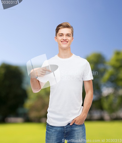 Image of smiling young man in blank white t-shirt